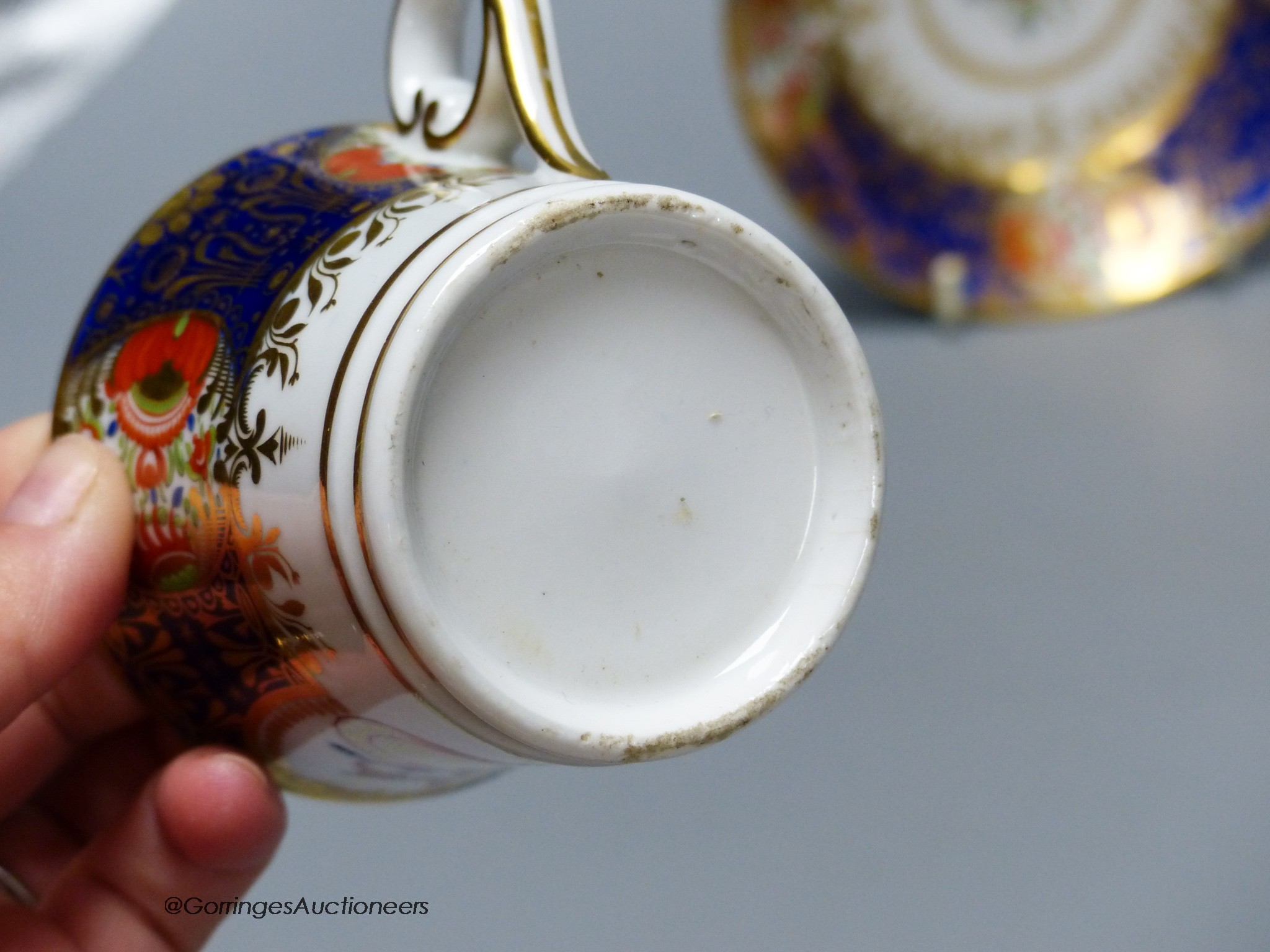 A Chamberlain armorial or crested cup and saucer in the style of the Yeo service and Chamberlain Worcester crested saucer